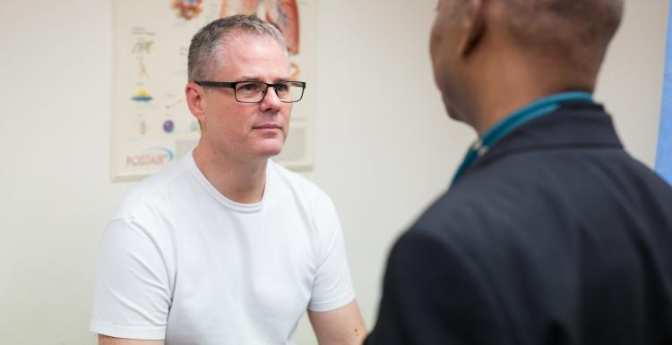 Patient talking with a professional in a doctors room