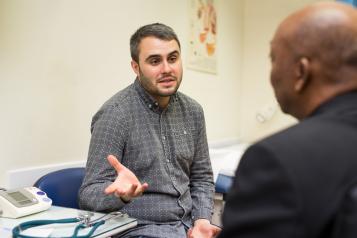 Man talking to his doctor