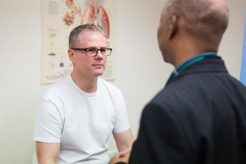 Patient talking with a professional in a doctors room