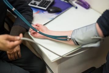 Image of someone having their blood pressure taken