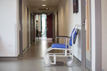 Hospital wheelchair left in a hallway