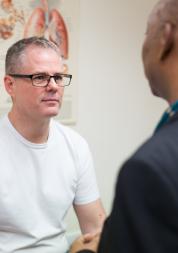 Patient talking with a professional in a doctors room